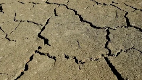 Cracked ground after drought soil drought concept. climate change and global Vídeo Stock 334030597