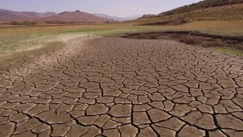 Cracked ground after drought soil drought concept. climate change and global Vídeo Stock 334030654