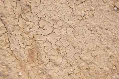 Cracked ground. Broken earth texture wallpaper sault. Stock Photos
