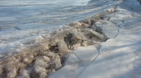 Cracked ice riverside Stock Footage 36058091