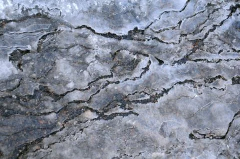Cracked ice on the spring Stock Photos
