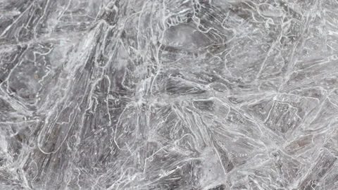 Cracked ice surface texture closeup top view, natural background Stock Footage 162753257