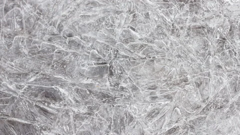 Cracked ice texture on surface, slow motion close-up, natural clean background Stock Footage 179857223