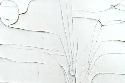 Cracked layer of white paint on the wall Stock Photos