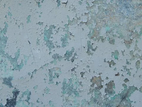 Cracked layers of paint on a cement surface Stock Photos