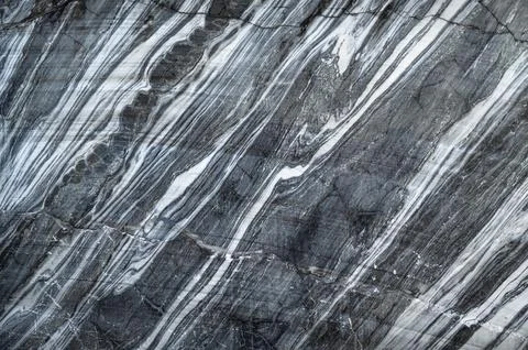 Cracked marble texture background. Close-up view of a marble quarry. 库存照片