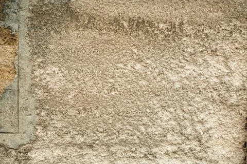 Cracked old stone wall background, dark grunge texture close up Stock Photos