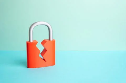 A cracked padlock. Security is compromised. The security system is compromise Stock Photos