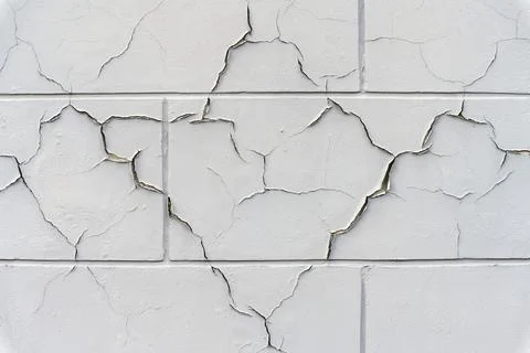 Cracked paint in facade wall Stock Photos