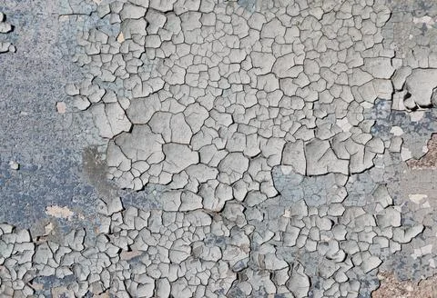 Cracked paint on the surface texture of the old wall. Stock Photos