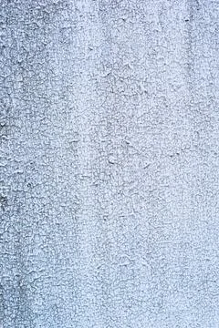 Cracked paint wall background. Old cracked paint on the concrete wall. Stock Photos