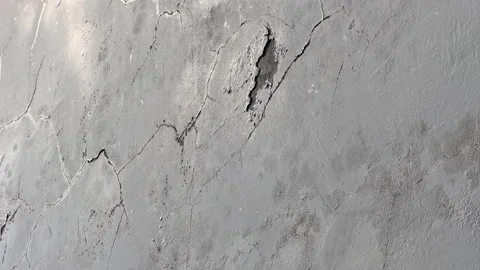 Cracked paint on weathered cement render wall texture Stock Footage 328961588
