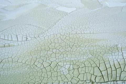 Cracked peeling paint texture background with green and white layers Stock Photos