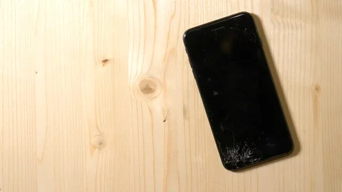 Cracked phone on the floor Stock Footage 101486998