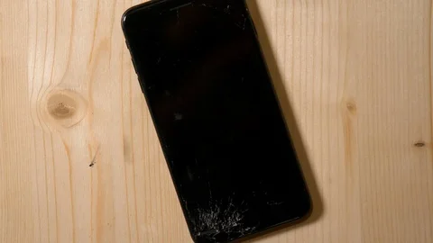 Cracked phone on the floor Stock Footage 101487007