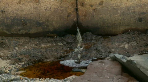 Cracked Pipe Leaking Waste - Water Pollution, Zoomed Out. Stock Footage