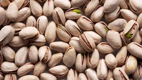 Cracked pistachios in shells. Crunchy roasted nuts. Stock Footage 334872410