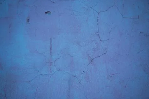 Cracked plaster of the structure. Background, pink texture, structure. Stock Photos