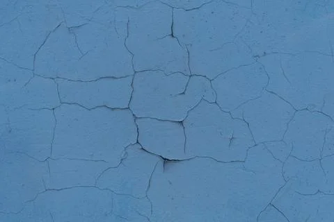 Cracked plaster structure. Background, texture. Neutral blue color. Stock Photos