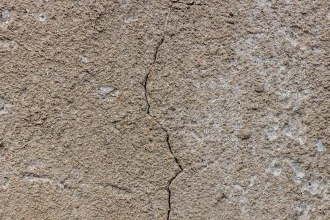 Cracked plaster on the wall, background, texture Stock Photos