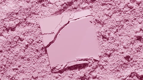 Cracked powder on pale pink surface with dynamic shadows Stock Footage 343046758