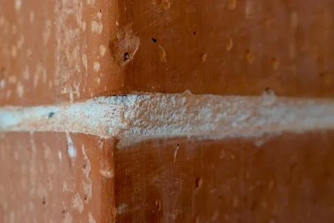 Cracked red brick, close up texture Stock Photos