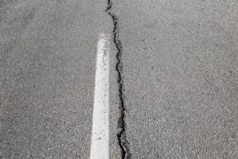 Cracked road background Stock Photos