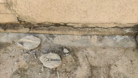 Cracked rough surface between wall and floor showing aged texture 写真素材