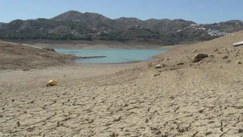 Cracked soil and dry river water sources lake drying cracked earth ecosystems 스톡 동영상 334029956