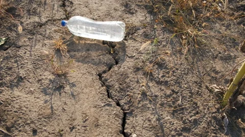 Cracked soil with bottle of water. Stock Footage 263261636