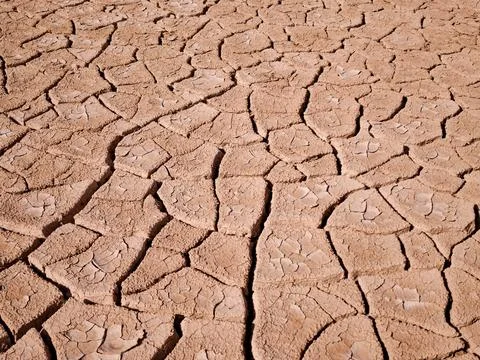 Cracked soil surface texture concept of climate change and water shortage i.. Stock Photos