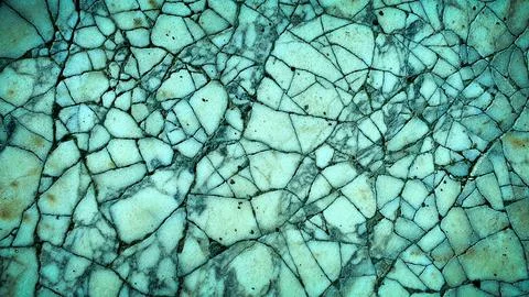 Cracked stone texture in cool turquoise and beige tones, offering a fresh a.. Illustrazione stock