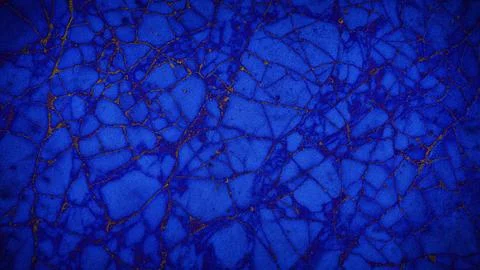 A cracked stone texture with vibrant blue and gold tones, offering a luxuri.. Illustrazione stock