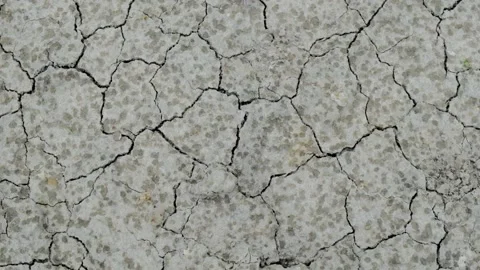 Cracked surface soil from arid and dry , droplets rain falling drop on ground Stock Footage 139773414
