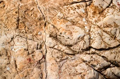 Cracked the surface of the stone as a background Stock Photos