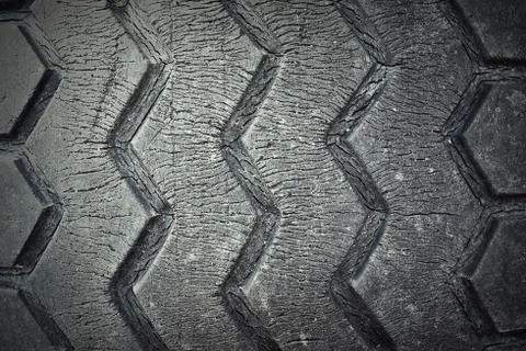 Cracked surface of a weathered tyre, texture Stock Photos