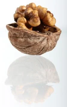 Cracked walnut with reflection Stock Photos