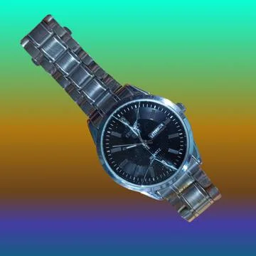 Cracked watch on multi-colored background Stock Photos