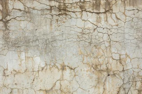 Cracked weathered wall texture in rustic outdoor setting Stock Photos