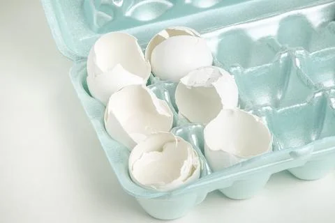Cracked White Egg Shells On Styrofoam Tray Stock Photos