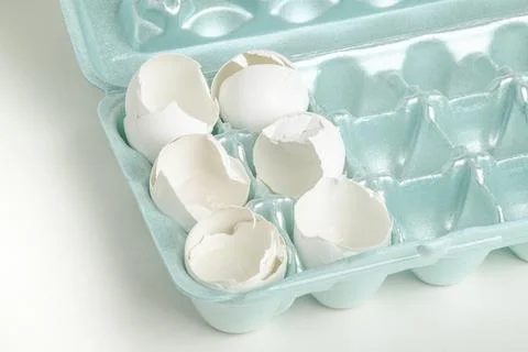 Cracked White Egg Shells On Styrofoam Tray Stock Photos