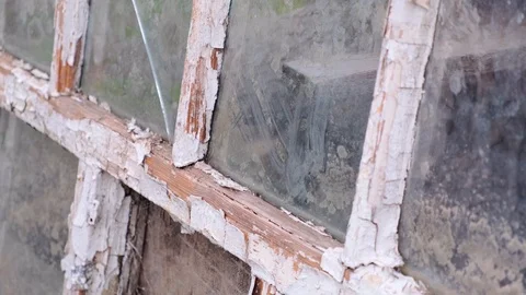 Cracked white on a frames of windows with glass. Antique vintage wooden window Stock Footage 126650301