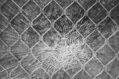 Cracked window or glass as a spider web. Stock Photos