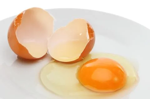 Crackeg egg and shell Stock Photos