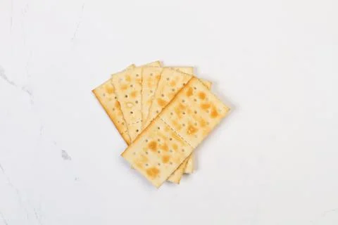 Cracker biscuits on a marble kitchen countertop in a top view Foto stock