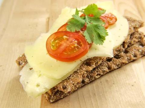 Cracker with cheese and tomato Stock Photos