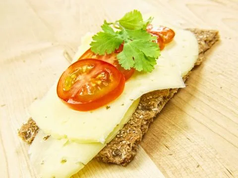 Cracker, cheese, tomato and parsely Stock Photos