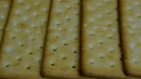 Cracker close-up, delicious crackers sprinkled with salt. Stock Footage 141324853