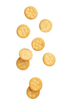 Cracker cookies falling isolated on white background with clipping path Stock Photos