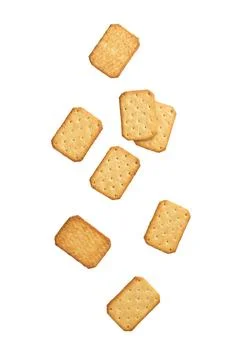 Cracker cookies falling isolated on white background with clipping path Stock Photos
